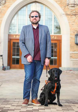 Adjunct professor Marcus Engel with his dog James